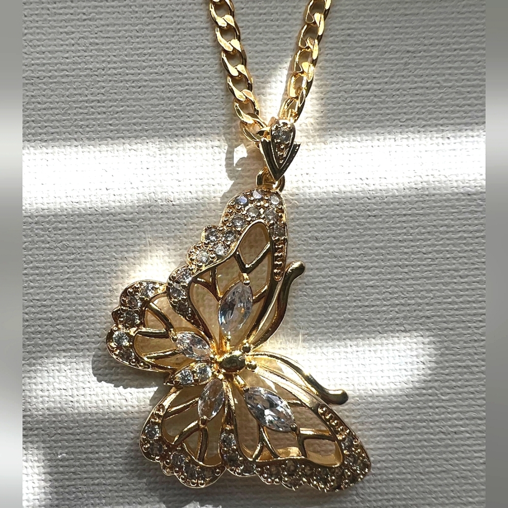 Cuban link chain and butterfly pendant with vertical drop. 14k Laminated Gold.